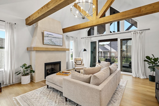 5831 Branta Dr, Franklin, TN 37064 - living area featuring beamed ceiling, light wood-style flooring, a large fireplace, a chandelier, and high vaulted ceiling
