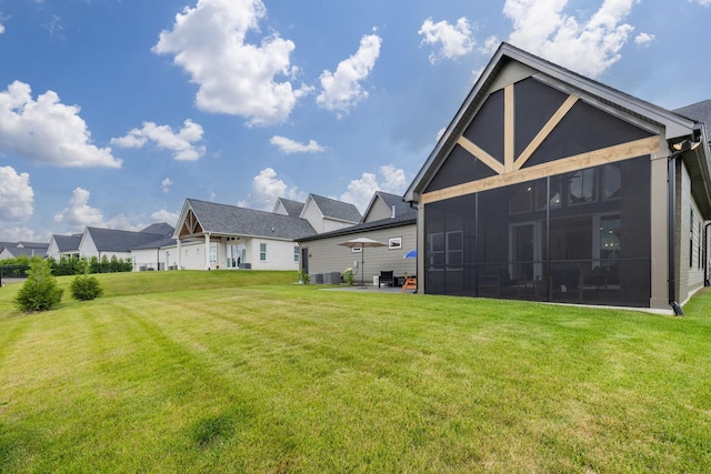 5831 Branta Dr, Franklin, TN 37064 - rear view of property with a yard, a sunroom, and a patio