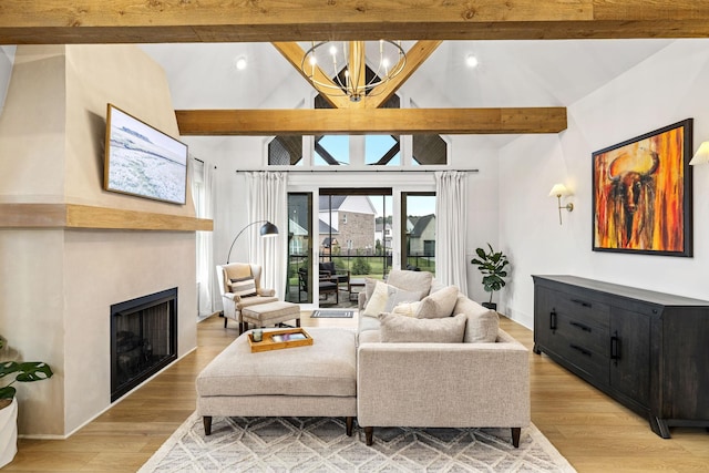 5831 Branta Dr, Franklin, TN 37064 - living room featuring a chandelier, a fireplace, light wood finished floors, and recessed lighting