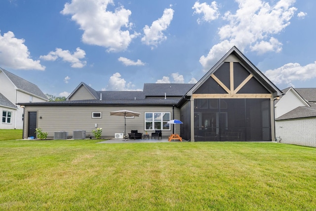 5831 Branta Dr, Franklin, TN 37064 - back of property featuring a patio area, a lawn, and a sunroom
