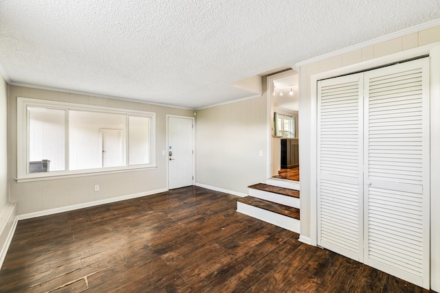 2010 Olympia Pl, Murfreesboro, TN 37130 - foyer entrance featuring dark wood-style floors, a textured ceiling, crown molding, and stairs