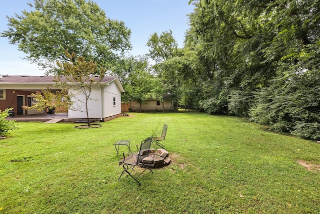 2010 Olympia Pl, Murfreesboro, TN 37130 - view of green lawn with a fire pit and a patio area