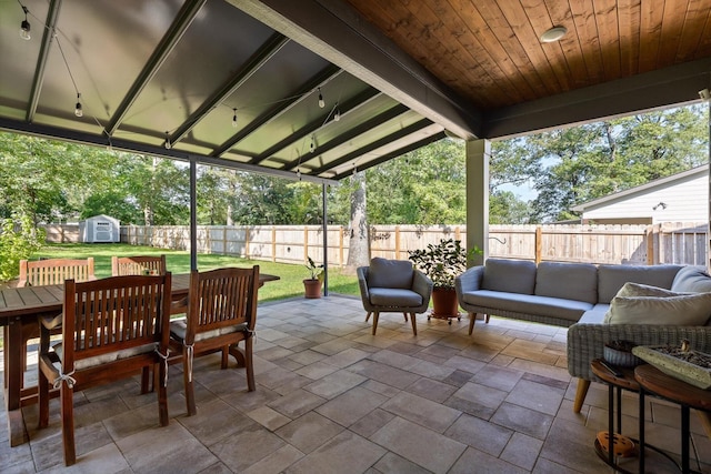 8408 Morin Rd, Chattanooga, TN 37421 - fenced backyard featuring an outdoor living space, a patio, a shed, and outdoor dining space