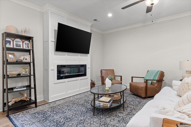 8408 Morin Rd, Chattanooga, TN 37421 - living area with ceiling fan, ornamental molding, wood finished floors, and a glass covered fireplace