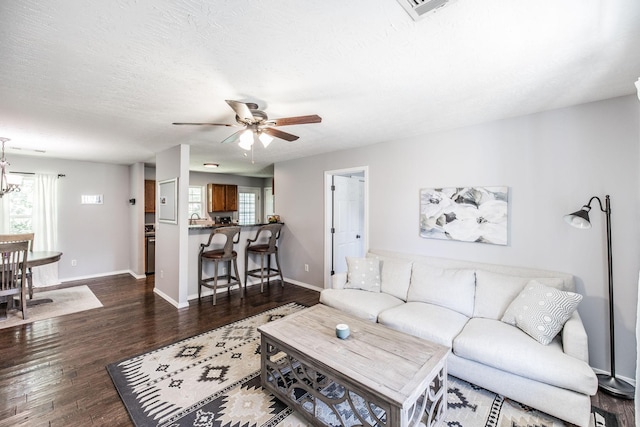 112 Ray Ave, Old Hickory, TN 37138 - living area with dark wood-style flooring, a ceiling fan, healthy amount of natural light, and a chandelier
