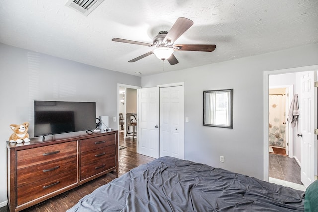 112 Ray Ave, Old Hickory, TN 37138 - bedroom featuring dark wood-type flooring, a closet, ceiling fan, ensuite bathroom, and a textured ceiling