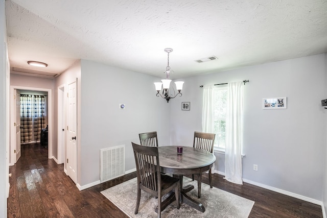 112 Ray Ave, Old Hickory, TN 37138 - dining space featuring wood finished floors, a textured ceiling, and a chandelier