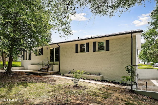 588 Meadowbrook Dr, Mcminnville, TN 37110 - rear view of property with brick siding and entry steps