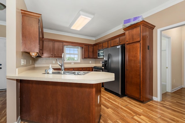 1324 Mockingbird Ln, Murfreesboro, TN 37130 - kitchen with black fridge, stainless steel microwave, a peninsula, crown molding, and light countertops