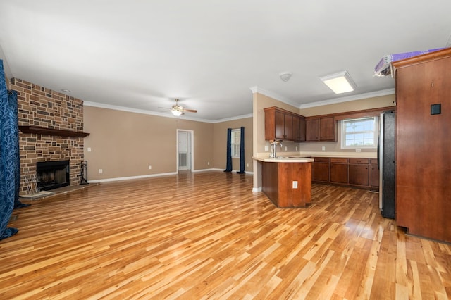 1324 Mockingbird Ln, Murfreesboro, TN 37130 - kitchen with open floor plan, freestanding refrigerator, light wood-type flooring, light countertops, and ceiling fan