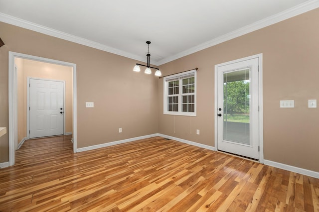1324 Mockingbird Ln, Murfreesboro, TN 37130 - unfurnished dining area with ornamental molding, light wood-style flooring, and a chandelier