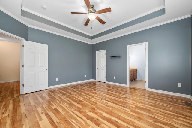 1324 Mockingbird Ln, Murfreesboro, TN 37130 - unfurnished bedroom featuring light wood-style floors, a raised ceiling, ornamental molding, connected bathroom, and ceiling fan