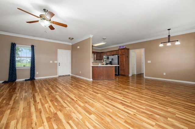 1324 Mockingbird Ln, Murfreesboro, TN 37130 - unfurnished living room featuring light wood finished floors, ceiling fan, and crown molding