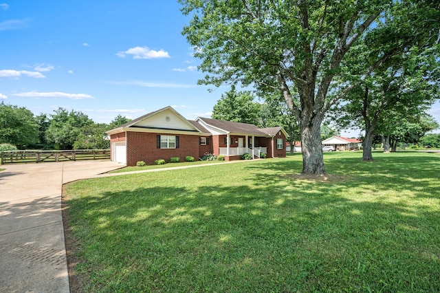 1324 Mockingbird Ln, Murfreesboro, TN 37130 - single story home with driveway, a garage, a porch, and brick siding
