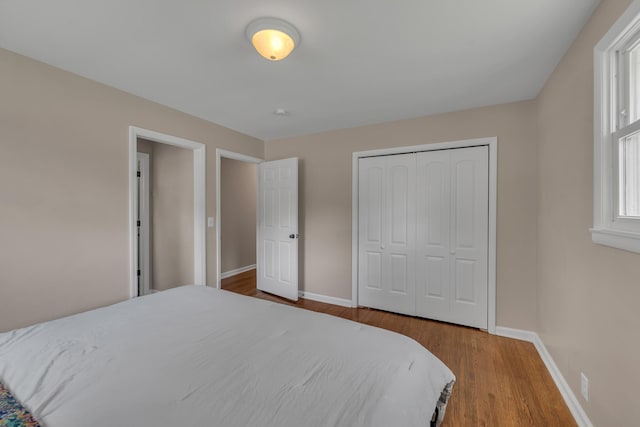 909 Woods Lake Dr, Madison, TN 37115 - bedroom featuring wood finished floors and a closet