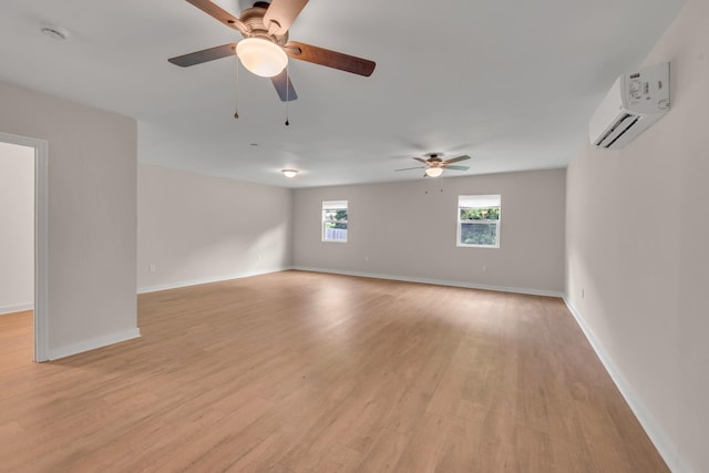 909 Woods Lake Dr, Madison, TN 37115 - unfurnished room with a wall unit AC, light wood finished floors, a ceiling fan, and a smoke detector