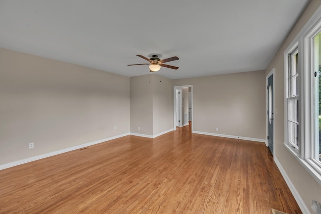 909 Woods Lake Dr, Madison, TN 37115 - empty room with light wood finished floors and a ceiling fan