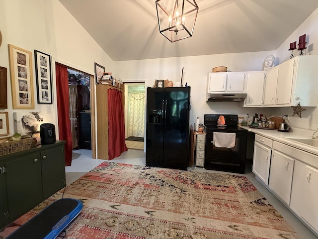 160 Webb Rd, Summertown, TN 38483 - kitchen with black appliances, under cabinet range hood, vaulted ceiling, white cabinetry, and light countertops