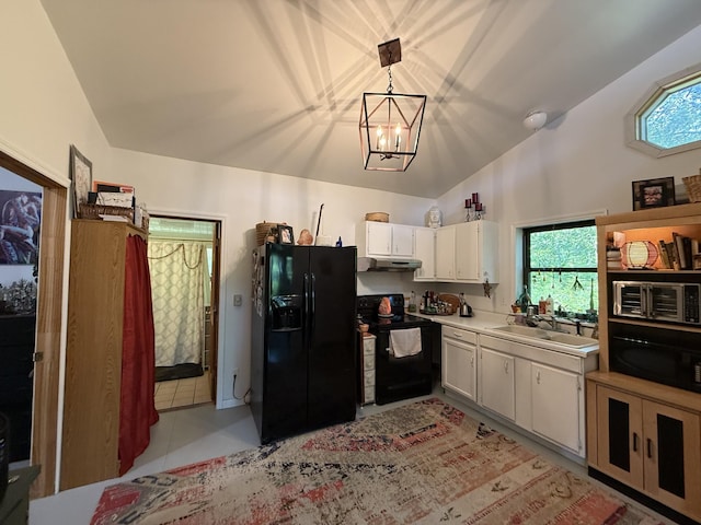 160 Webb Rd, Summertown, TN 38483 - kitchen with black appliances, lofted ceiling, light countertops, under cabinet range hood, and white cabinetry