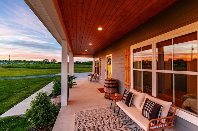 1446 Littleton Ranch Rd, Castalian Springs, TN 37031 - patio terrace at dusk featuring covered porch