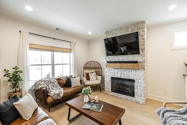 1446 Littleton Ranch Rd, Castalian Springs, TN 37031 - living room with a stone fireplace, crown molding, wood finished floors, and recessed lighting