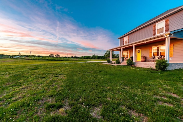 1446 Littleton Ranch Rd, Castalian Springs, TN 37031 - yard at dusk with a yard and a patio