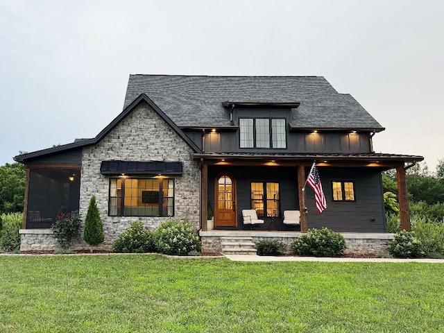 1782 Honey Ln, Estill Springs, TN 37330 - modern farmhouse style home with covered porch, board and batten siding, a front yard, and stone siding