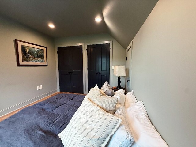1782 Honey Ln, Estill Springs, TN 37330 - bedroom with two closets, recessed lighting, wood finished floors, and vaulted ceiling