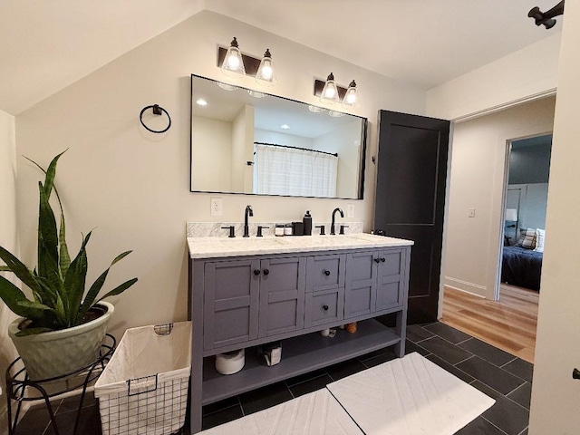 1782 Honey Ln, Estill Springs, TN 37330 - ensuite bathroom with double vanity, lofted ceiling, and a shower with curtain