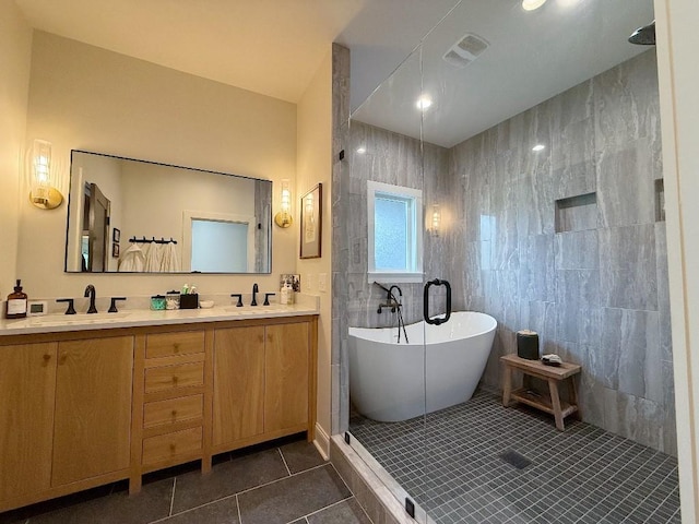 1782 Honey Ln, Estill Springs, TN 37330 - bathroom featuring tile patterned floors, a freestanding tub, double vanity, tiled shower, and tile walls