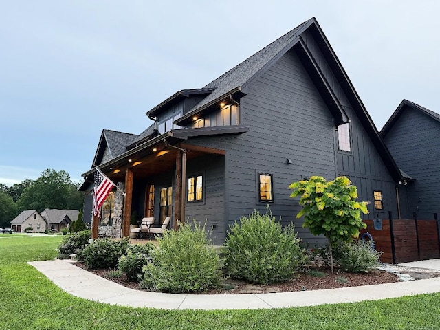 1782 Honey Ln, Estill Springs, TN 37330 - view of property exterior with board and batten siding, a yard, and a porch