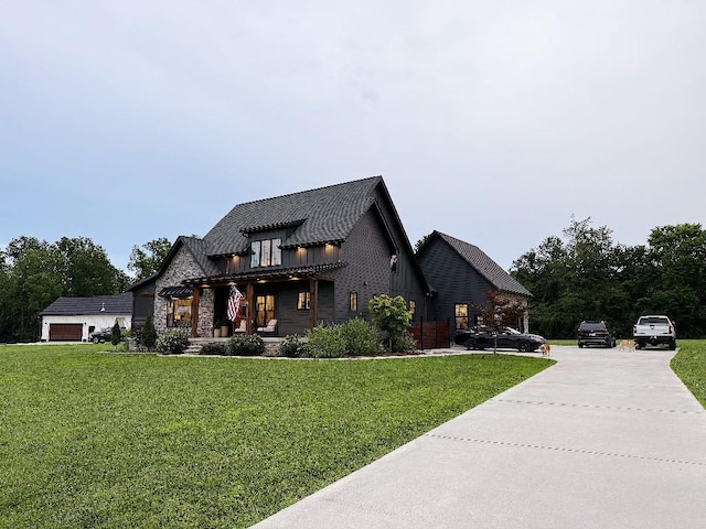 1782 Honey Ln, Estill Springs, TN 37330 - view of front of property featuring board and batten siding, a front yard, and stone siding