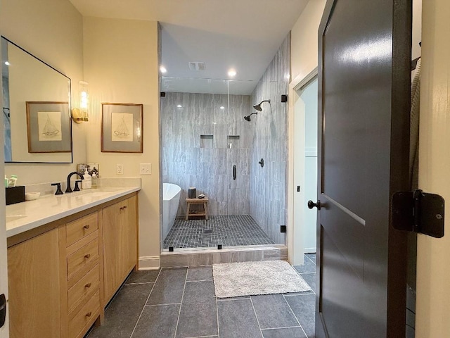1782 Honey Ln, Estill Springs, TN 37330 - full bath with vanity, a soaking tub, a shower stall, recessed lighting, and tile patterned floors