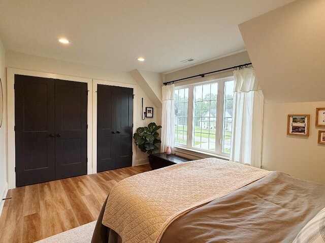 1782 Honey Ln, Estill Springs, TN 37330 - bedroom featuring wood finished floors, multiple closets, and recessed lighting