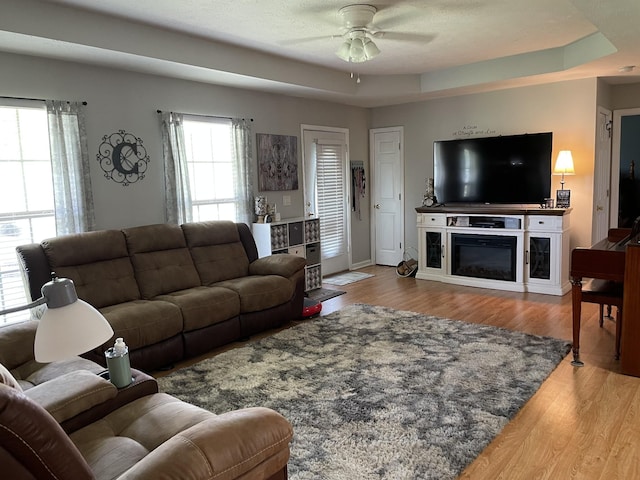 125 Monument Cir, Summertown, TN 38483 - living area featuring a ceiling fan, wood finished floors, and a raised ceiling