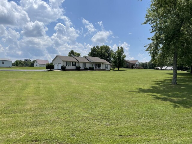 125 Monument Cir, Summertown, TN 38483 - view of front of house with a front yard and an attached garage