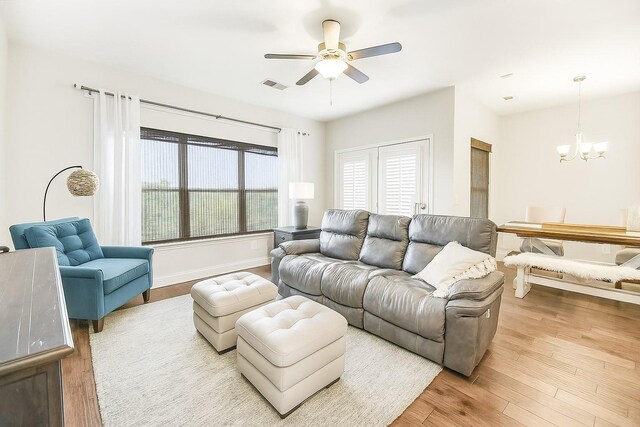 835 Meadowcrest Way, Lebanon, TN 37090 - living room featuring a chandelier, a ceiling fan, and wood finished floors