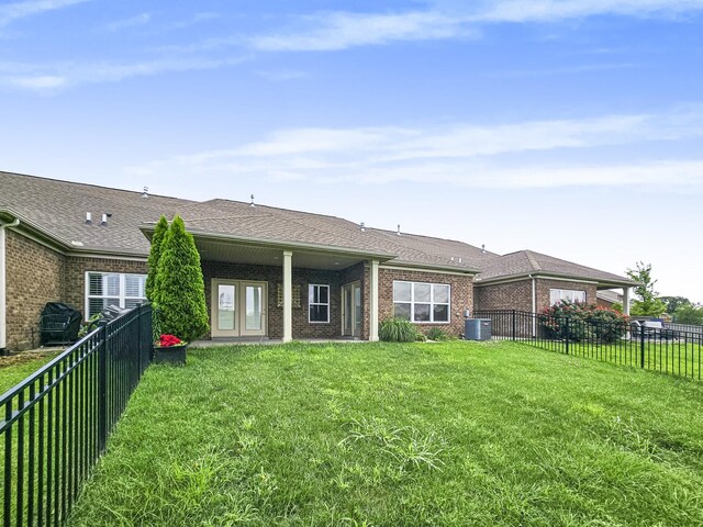 835 Meadowcrest Way, Lebanon, TN 37090 - rear view of house with brick siding, a fenced backyard, and roof with shingles