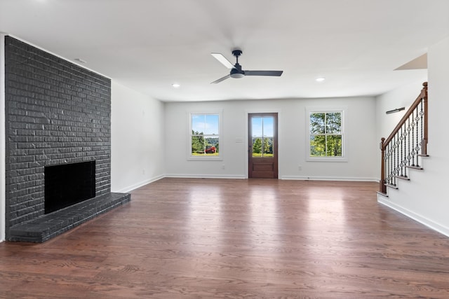 2210 Garners Creek Rd, Dickson, TN 37055 - unfurnished living room with wood finished floors, ceiling fan, a fireplace, stairway, and recessed lighting