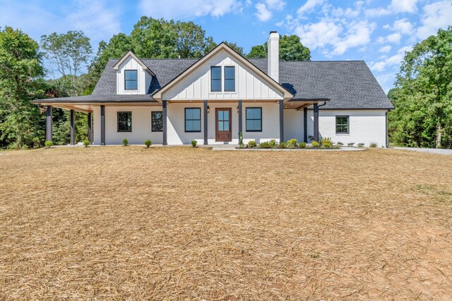 2210 Garners Creek Rd, Dickson, TN 37055 - modern inspired farmhouse featuring a chimney, board and batten siding, a shingled roof, and brick siding