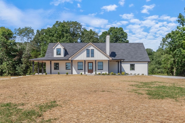 2210 Garners Creek Rd, Dickson, TN 37055 - modern inspired farmhouse featuring a chimney, a shingled roof, and a porch