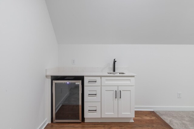 2210 Garners Creek Rd, Dickson, TN 37055 - bar with beverage cooler, wood finished floors, and vaulted ceiling