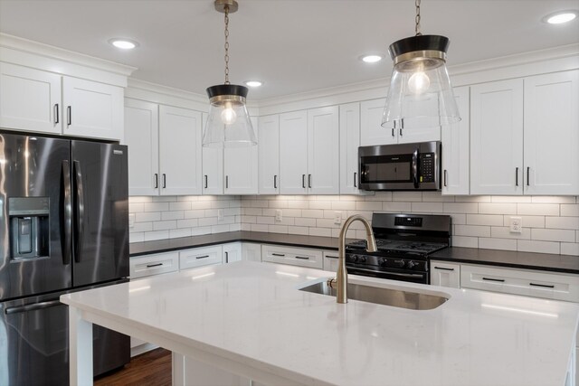 2210 Garners Creek Rd, Dickson, TN 37055 - kitchen with appliances with stainless steel finishes, pendant lighting, white cabinetry, backsplash, and recessed lighting