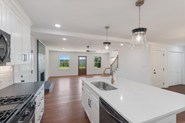 2210 Garners Creek Rd, Dickson, TN 37055 - kitchen with dishwashing machine, open floor plan, dark wood-style floors, recessed lighting, and an island with sink