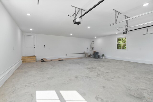 2210 Garners Creek Rd, Dickson, TN 37055 - garage with a garage door opener, recessed lighting, and gas water heater