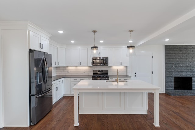 2210 Garners Creek Rd, Dickson, TN 37055 - kitchen with appliances with stainless steel finishes, tasteful backsplash, white cabinets, dark wood finished floors, and recessed lighting