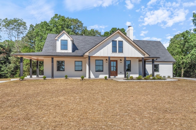 2210 Garners Creek Rd, Dickson, TN 37055 - modern farmhouse with brick siding, a chimney, a porch, and a shingled roof