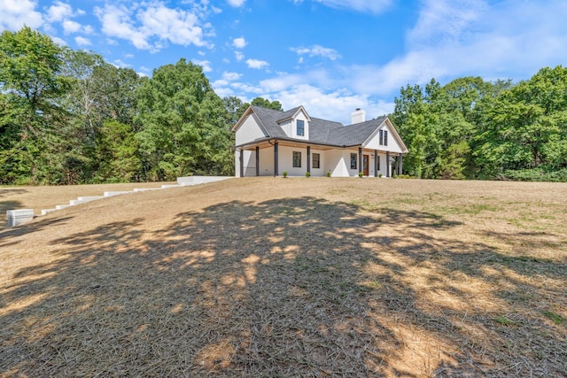 2210 Garners Creek Rd, Dickson, TN 37055 - view of home's exterior with a garage, a chimney, driveway, and a porch