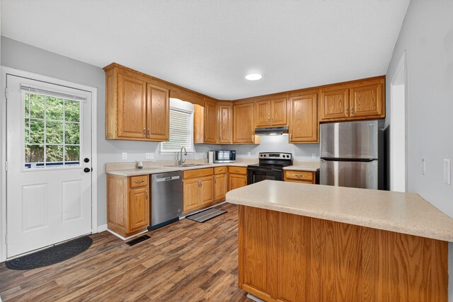 7 Summerfield Dr, Fayetteville, TN 37334 - kitchen with appliances with stainless steel finishes, under cabinet range hood, dark wood finished floors, light countertops, and recessed lighting