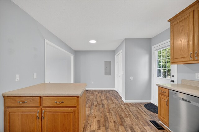7 Summerfield Dr, Fayetteville, TN 37334 - kitchen with stainless steel dishwasher, electric panel, light wood-style flooring, light countertops, and brown cabinets
